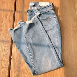 LOFT mid rise skinny jeans with distressed ankles